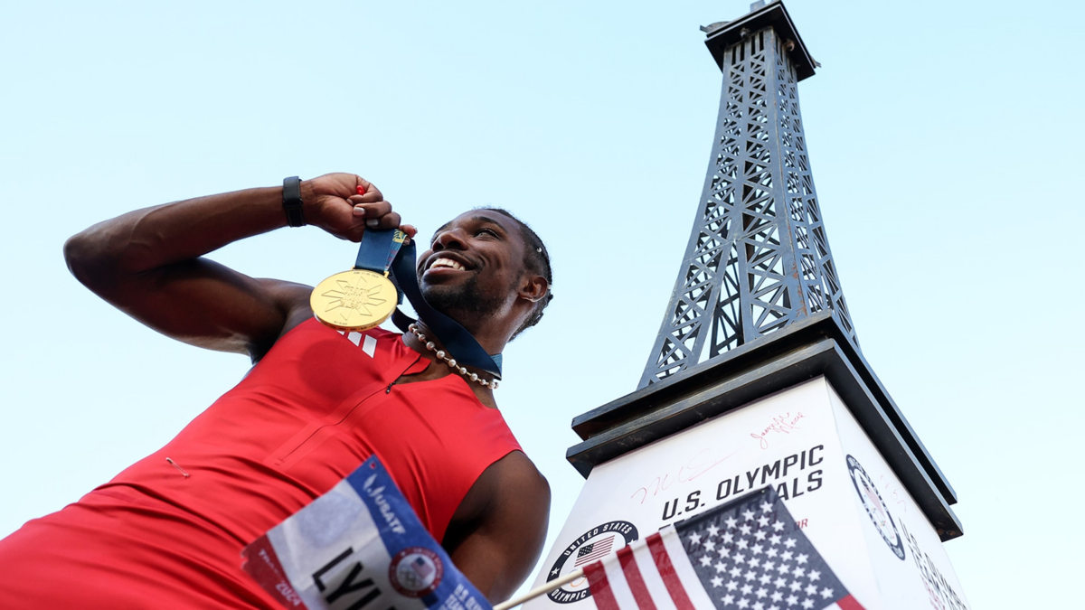 Noah Lyles celebrates with the gold medal after winning the men's 100m final on Day 3 of the 2024 U.S. Olympic Track and Field Trials at Hayward Field on June 23