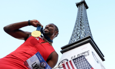 Noah Lyles celebrates with the gold medal after winning the men's 100m final on Day 3 of the 2024 U.S. Olympic Track and Field Trials at Hayward Field on June 23