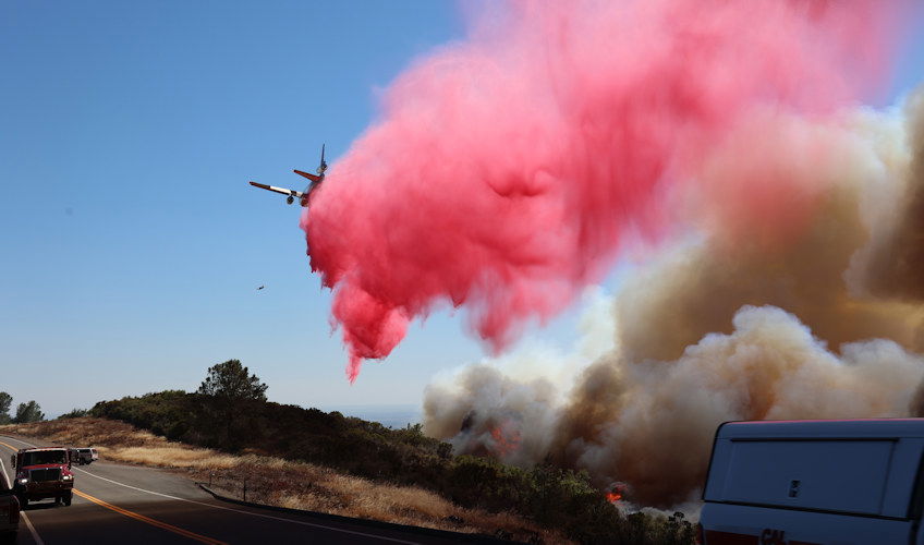 Air tanker drops retardant Friday in bid to slow California's fast-growing Park Fire.