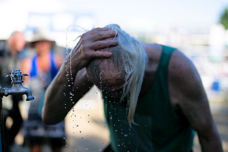 A person cools off during the Waterfront Blues Festival on Friday in Portland. 