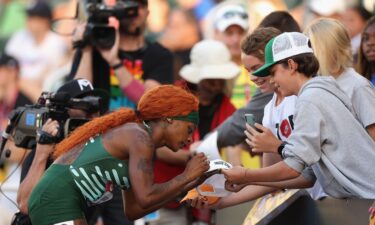 Sha'Carri Richardson signs autographs for fans following the Women's 100m Semi Final during the 2023 USATF Outdoor Championships at Hayward Field on July 07