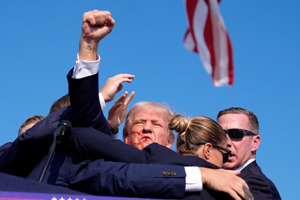 Republican presidential candidate former President Donald Trump is surrounded by U.S. Secret Service agents at a campaign rally, Saturday in Butler, Pa. 