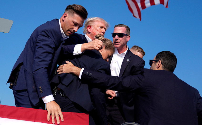 Republican presidential candidate former President Donald Trump is surrounded by U.S. Secret Service agents at a campaign rally on Saturday in Butler, Pa. 