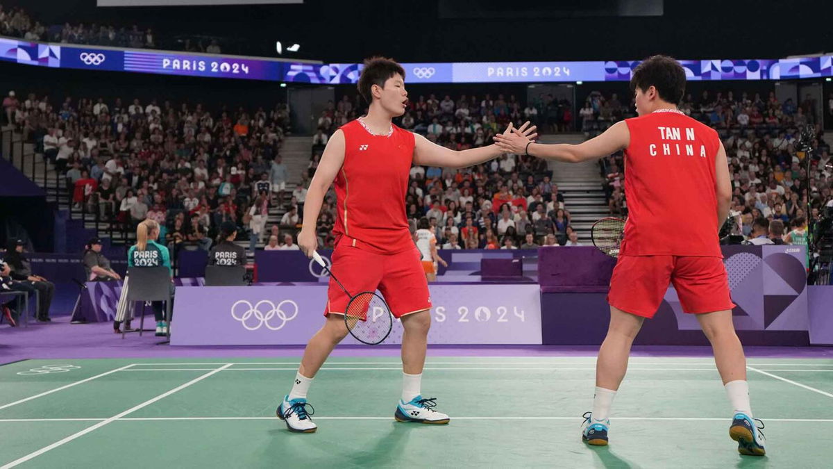 Sheng Shu Liu and Ning Tan (CHN) compete in a women's doubles badminton match during the Paris 2024 Olympic Summer Games at Adidas Arena.