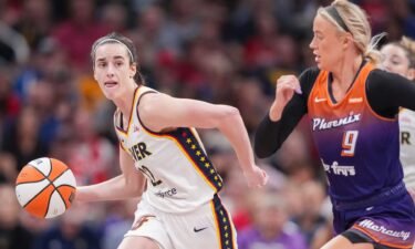 Indiana Fever guard Caitlin Clark (22) rushes up the court against Phoenix Mercury guard Sophie Cunningham (9) on Friday
