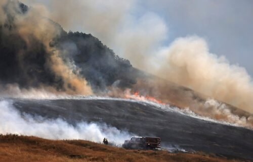 A wildfire spreads uphill west of Petaluma