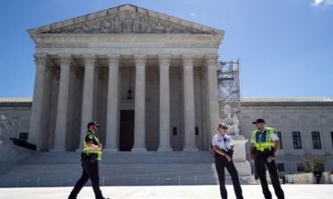Police guard the plaza in front of the Supreme Court building in Washington on July 1. The Supreme Court said July 2 that it won’t take up a challenge to parts of a federal law that bar convicted felons and drug users from possessing firearms