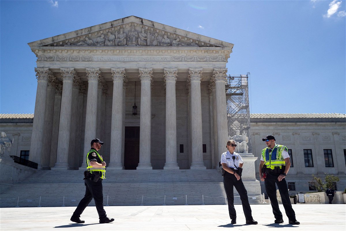 <i>Allison Bailey/Middle East Images/AFP/Getty Images via CNN Newsource</i><br/>Police guard the plaza in front of the Supreme Court building in Washington on July 1. The Supreme Court said July 2 that it won’t take up a challenge to parts of a federal law that bar convicted felons and drug users from possessing firearms