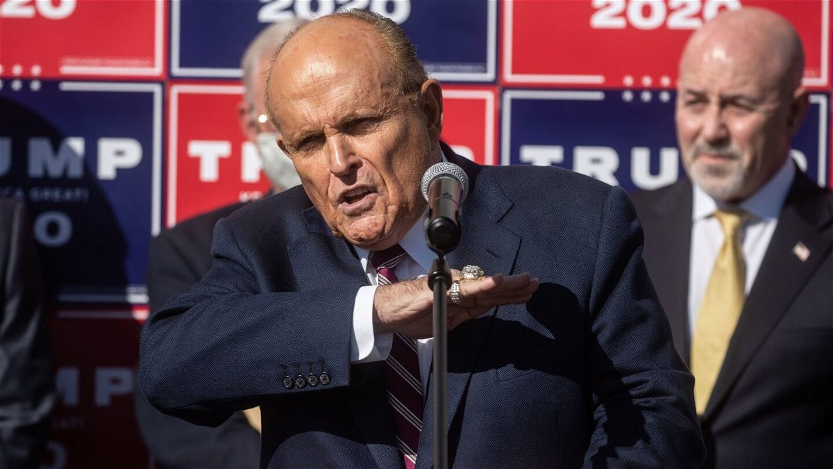 <i>Brandon Bell/Getty Images via CNN Newsource</i><br/>Rudy Giuliani speaks to members of the media where Republican candidate Florida Gov. Ron DeSantis was scheduled to host a campaign event on January 21