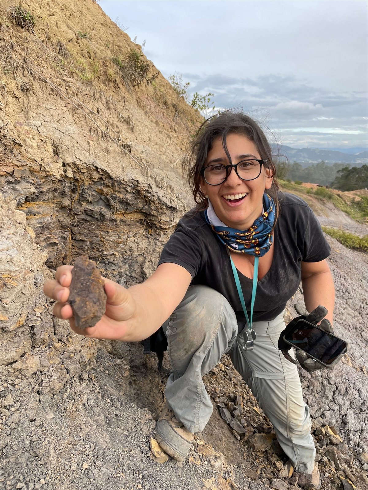 <i>Fabiany Herrera via CNN Newsource</i><br/>Mónica Carvalho can be seen holding the newly discovered earliest grape from the Western Hemisphere at the dig site in Colombia.