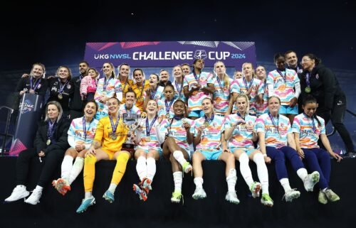 San Diego Wave players and coaches pose for a team photo after winning the 2024 NWSL Challenge Cup.