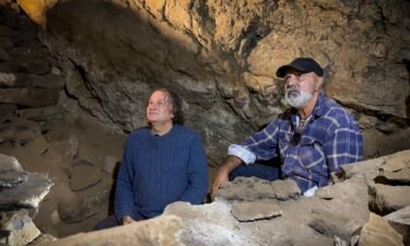Professor Bruno David (L) and Uncle Russell Mullett (R) pictured in the cave.