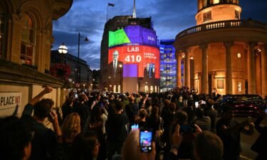 An exit poll predicting that Keir Starmer's Labour Party will win 410 seats in Britain's general election is projected onto BBC Broadcasting House in London on July 4