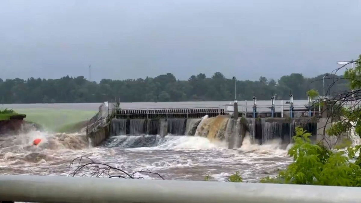 <i>Noah Cornelius/WGBA via CNN Newsource</i><br/>Water rushes from Manawa Dam in Wisconsin on Friday.
