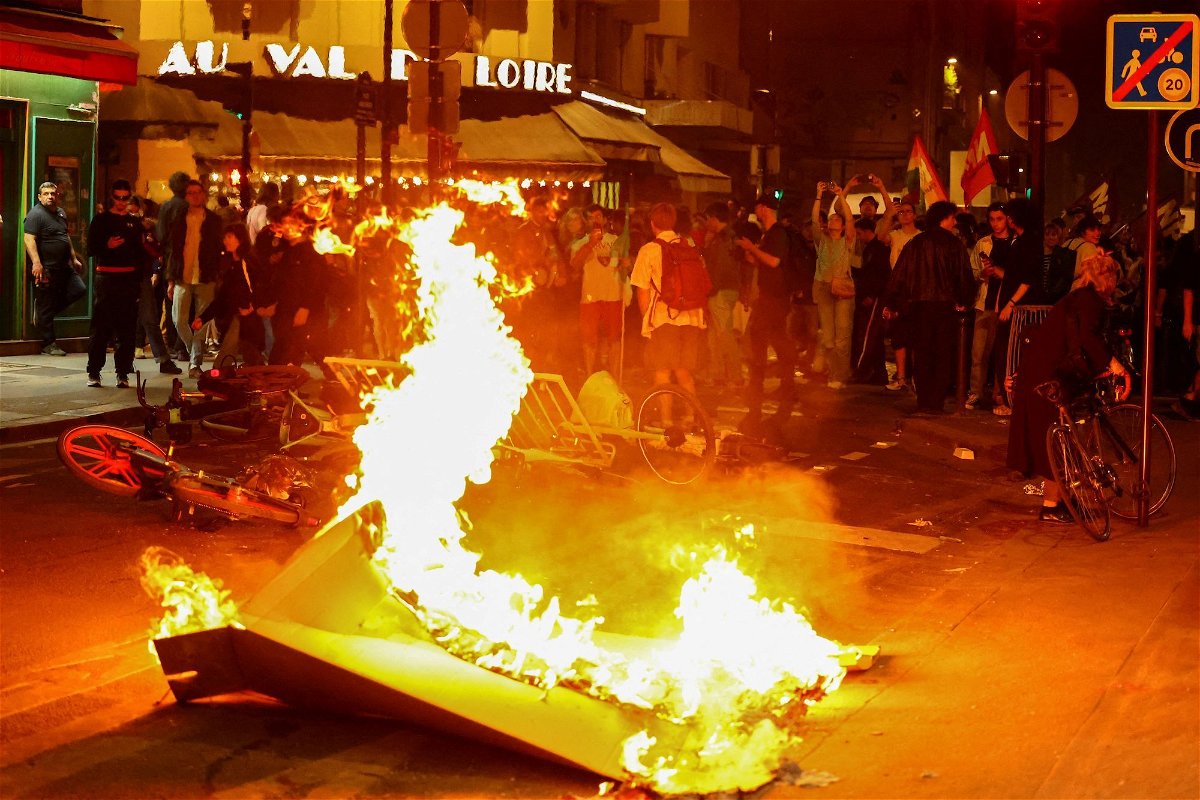 <i>Fabrizio Bensch/Reuters via CNN Newsource</i><br/>A barricade burns as protesters demonstrate against the far right in Paris