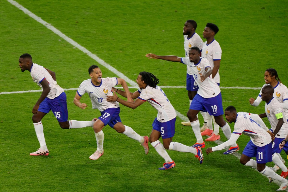 <i>Odd Andersen/AFP/Getty Images via CNN Newsource</i><br/>France's players celebrate after beating Portugal at Euro 2024.
