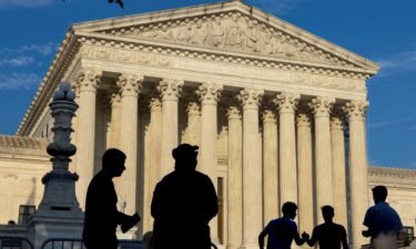People gather outside the U.S. Supreme Court in Washington on June 29. The Supreme Court ruled Monday that Donald Trump may claim immunity in his January 6 case.