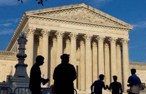 People gather outside the U.S. Supreme Court in Washington on June 29. The Supreme Court ruled Monday that Donald Trump may claim immunity in his January 6 case.