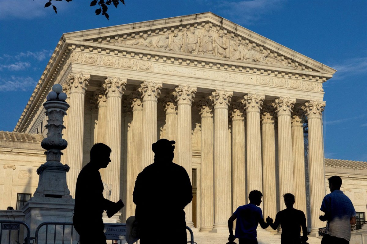 <i>Kevin Mohatt/Reuters via CNN Newsource</i><br/>People gather outside the U.S. Supreme Court in Washington on June 29. The Supreme Court ruled Monday that Donald Trump may claim immunity in his January 6 case.