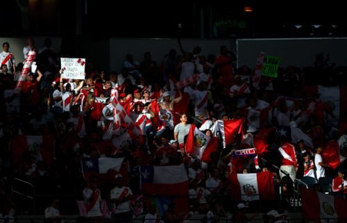 Peru's supporters cheer during a match between Peru and Chile at AT&T Stadium in Arlington