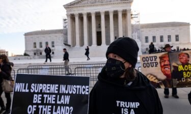 Anti-Trump demonstrators protest outside the US Supreme Court as the court considers whether former US President Donald Trump is eligible to run for president in the 2024 election in Washington