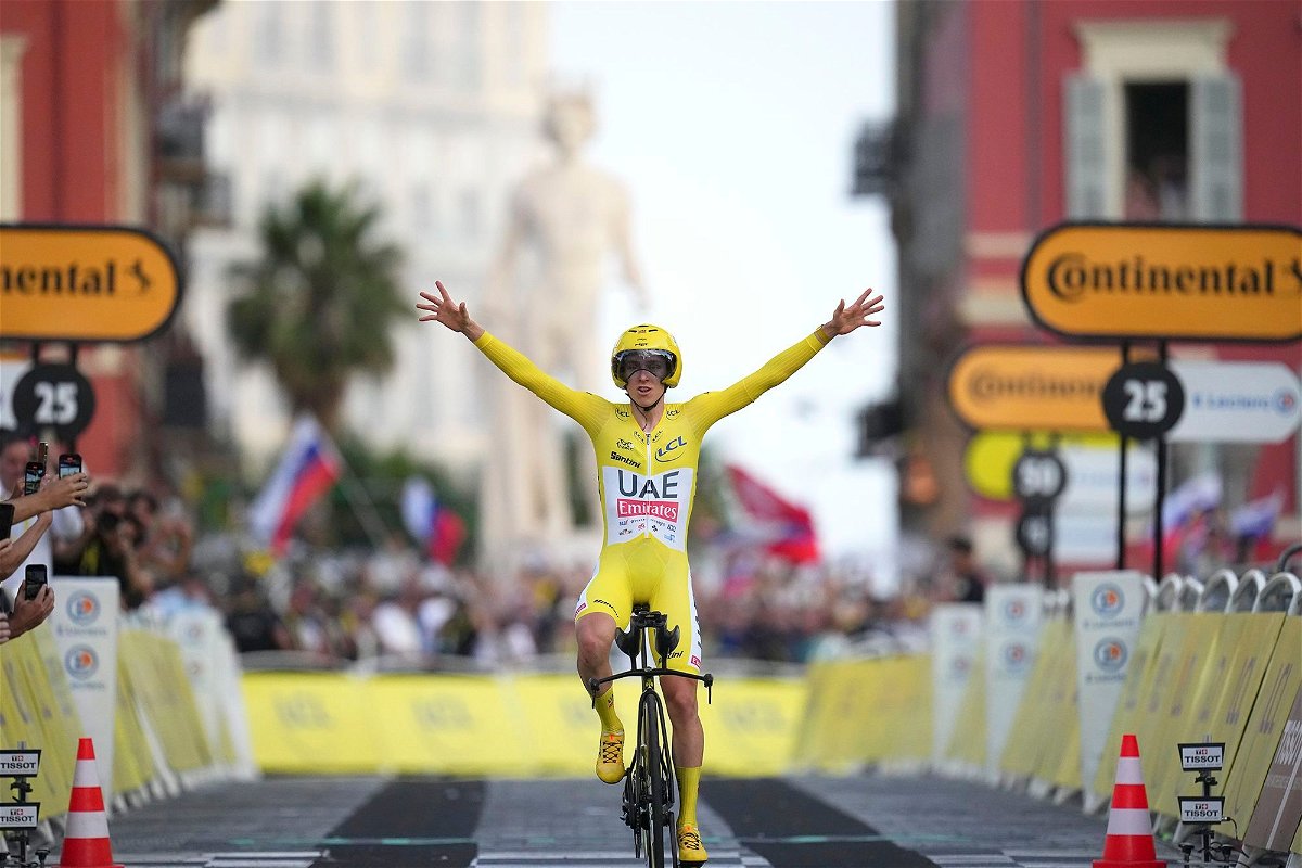 <i>Daniel Cole/AP via CNN Newsource</i><br/>Pogačar crosses the finish line of Sunday's time trial in Nice