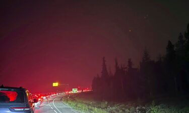 Cars clog the highway as people evacuate because of wildfires early July 23