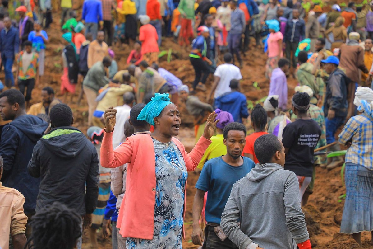 <i>Isayas Churga/Gofa Zone Government Communication Affairs Department/AP via CNN Newsource</i><br/>A woman cries as hundreds of people gather at the site of a mudslide.
