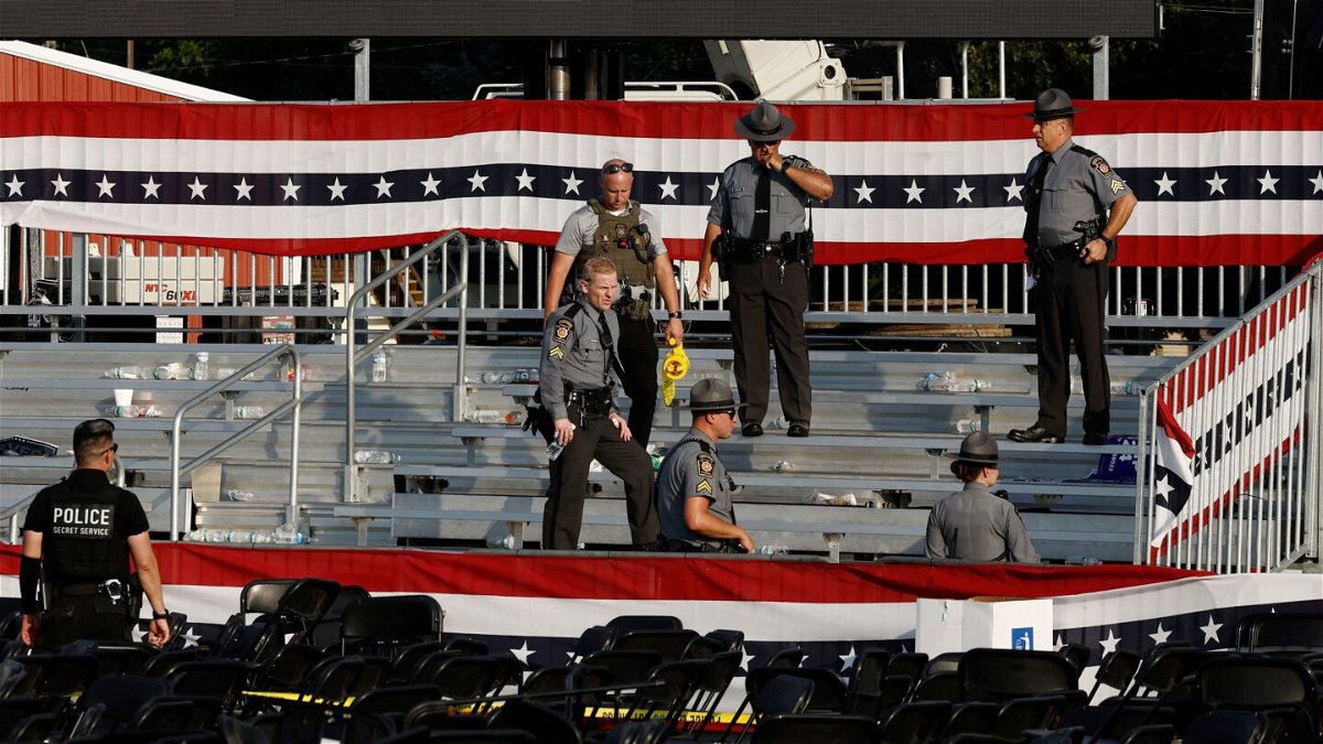 <i>Anna Moneymaker/Getty Images via CNN Newsource</i><br/>Law enforcement agents pictured near the stage of a campaign rally for Republican presidential candidate former President Donald Trump on July 13