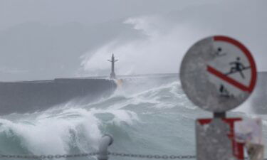 Waves break against the protecting walls as Typhoon Gaemi approaches in Keelung