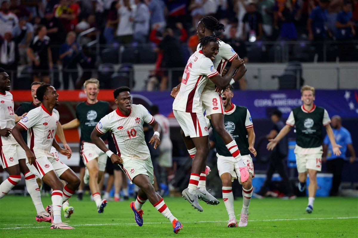 <i>Richard Rodriguez/AP via CNN Newsource</i><br/>Canada midfielder Ismaël Koné celebrates with his teammates after making the winning penalty kick.