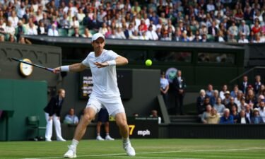 Andy Murray in action in the men's doubles match with his brother Jamie.