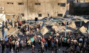 People search the rubble of a collapsed building in the aftermath of an Israeli attack at UNRWA’s Al-Jaouni school in al-Nuseirat camp in central Gaza on July 6.