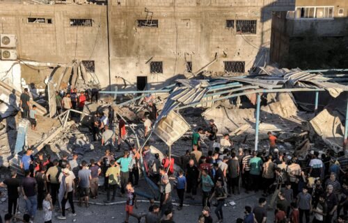 People search the rubble of a collapsed building in the aftermath of an Israeli attack at UNRWA’s Al-Jaouni school in al-Nuseirat camp in central Gaza on July 6.