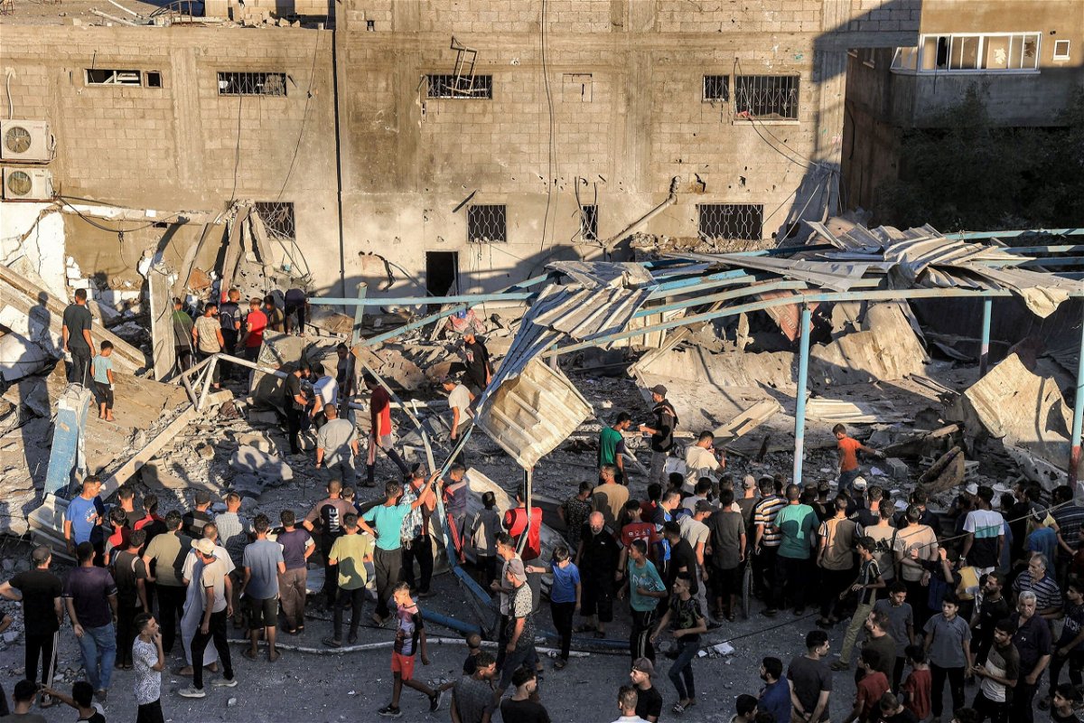<i>Eyad Baba/AFP/Getty Images via CNN Newsource</i><br/>People search the rubble of a collapsed building in the aftermath of an Israeli attack at UNRWA’s Al-Jaouni school in al-Nuseirat camp in central Gaza on July 6.