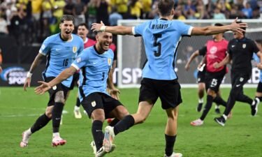 Uruguay's Manuel Ugarte celebrates after scoring the winning penalty against Brazil.