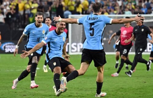 Uruguay's Manuel Ugarte celebrates after scoring the winning penalty against Brazil.