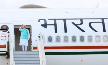 Prime Minister Narendra Modi boards his plane ahead of a visits to Russia and Austria
