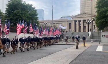 Protesters believed to be affiliated with the White supremacist group Patriot Front march near the Tennessee House of Representatives and the Tennessee State Capitol.