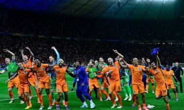 Dutch players dance to 'Links Rechts' on the pitch after beating Turkey in the quarterfinals.