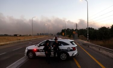 Israeli police secure a road as rockets are launched from southern Lebanon in the Israeli-annexed Golan Heights on July 9