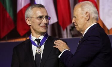U.S. President Joe Biden awards NATO Secretary General Jens Stoltenberg with the Presidential Medal of Freedom at a NATO event to commemorate the 75th anniversary of the alliance