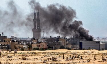 This picture taken from Khan Yunis in the southern Gaza Strip shows smoke plumes billowing during ongoing battles in the Sultan neighbourhood in the northwest of Rafah on June 18
