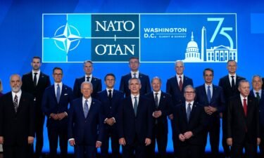 Heads of state pose for a group photo during the NATO 75th anniversary celebratory event on July 10