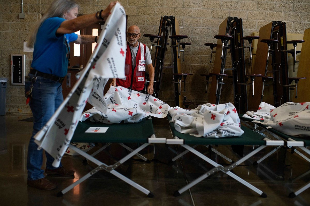 <i>Mark Felix/Bloomberg/Getty Images via CNN Newsource</i><br/>American Red Cross workers prepare cots in Houston