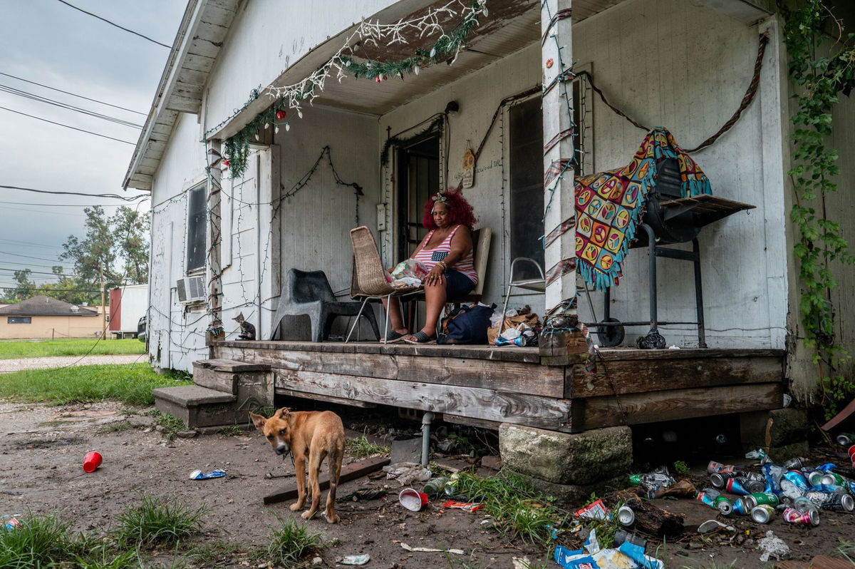 <i>Brandon Bell/Getty Images via CNN Newsource</i><br/>Menifee Lucy sits on her porch for air on Thursday as her Houston home remains without power.