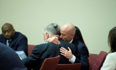 Attorney Luke Nikas embraces actor Alec Baldwin during his trial on involuntary manslaughter at Santa Fe County District Court in Santa Fe