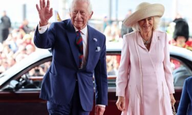 King Charles and Queen Camilla arrive at the Welsh parliament during a visit to commemorate the 25th anniversary of the Senedd