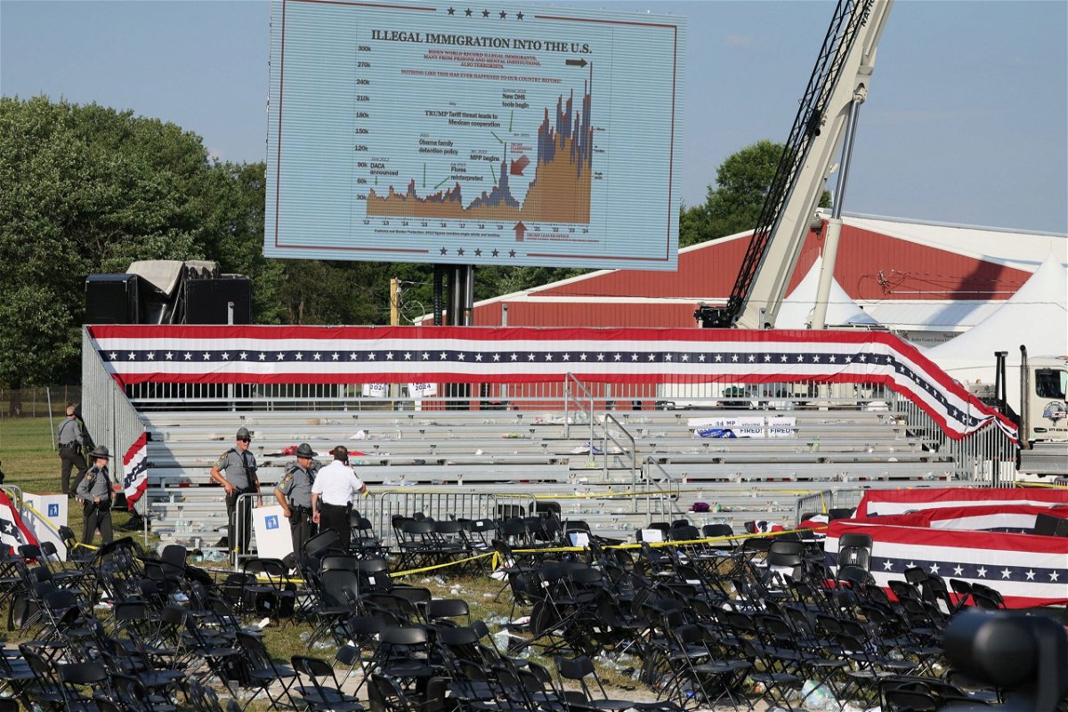 <i>Brendan McDermid/Reuters via CNN Newsource</i><br/>Security personnel inspect the scene in Butler