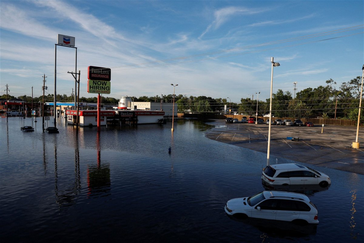 <i>Daniel Becerril/Reuters via CNN Newsource</i><br/>Cars and buildings are partially submerged in floodwaters in the aftermath of Hurricane Beryl in Houston on July 8